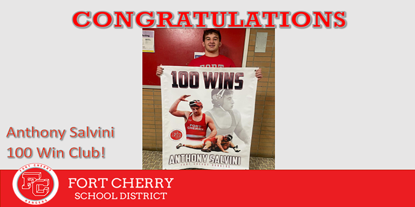 Picture of Anthony Salvini holding 100 wins banner for wrestling